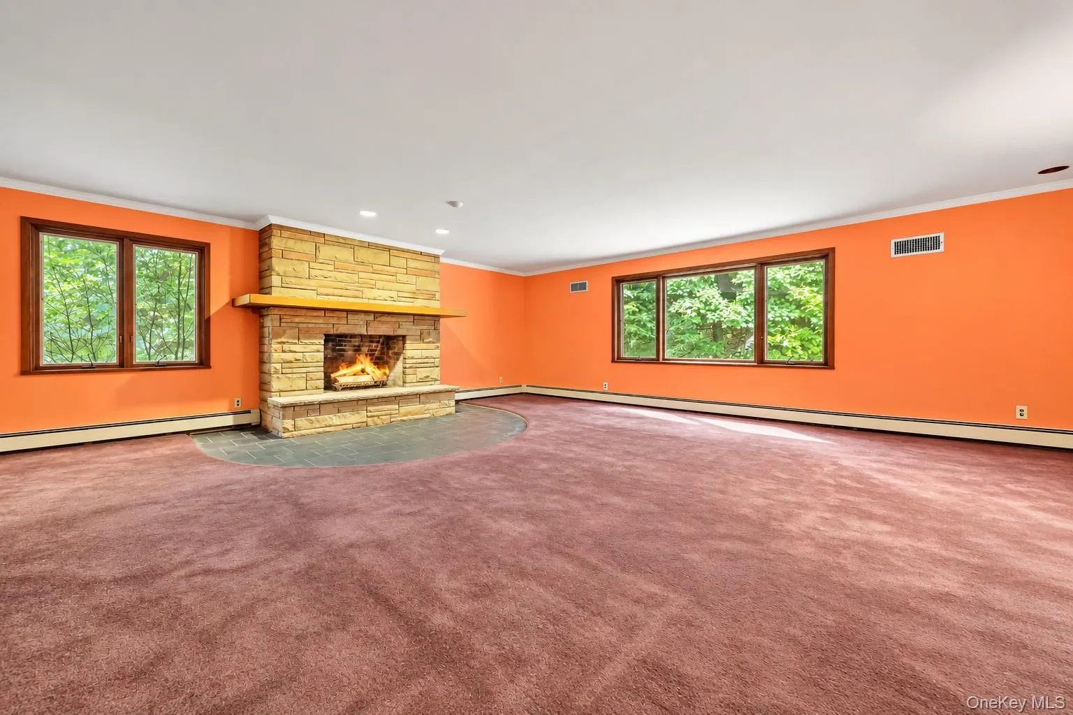 Stone fireplace with raised hearth Stone fireplace with raised hearth