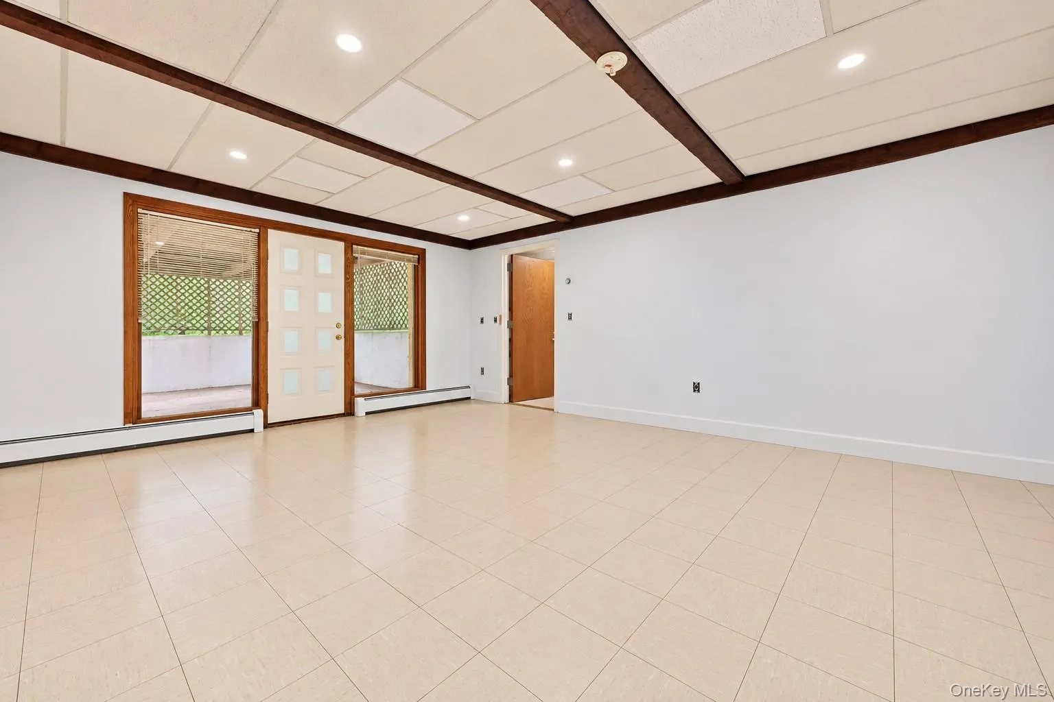 Great space for an office. Exterior door leads to patio and doorway leads to summer kitchen. Extraneous objects removed. Great space for an office. Exterior door leads to patio and doorway leads to summer kitchen. Extraneous objects removed.