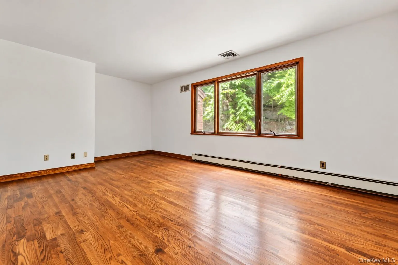 BR 3. Oversized windows. Wood floors. Extraneous objects removed from photo. BR 3. Oversized windows. Wood floors. Extraneous objects removed from photo.