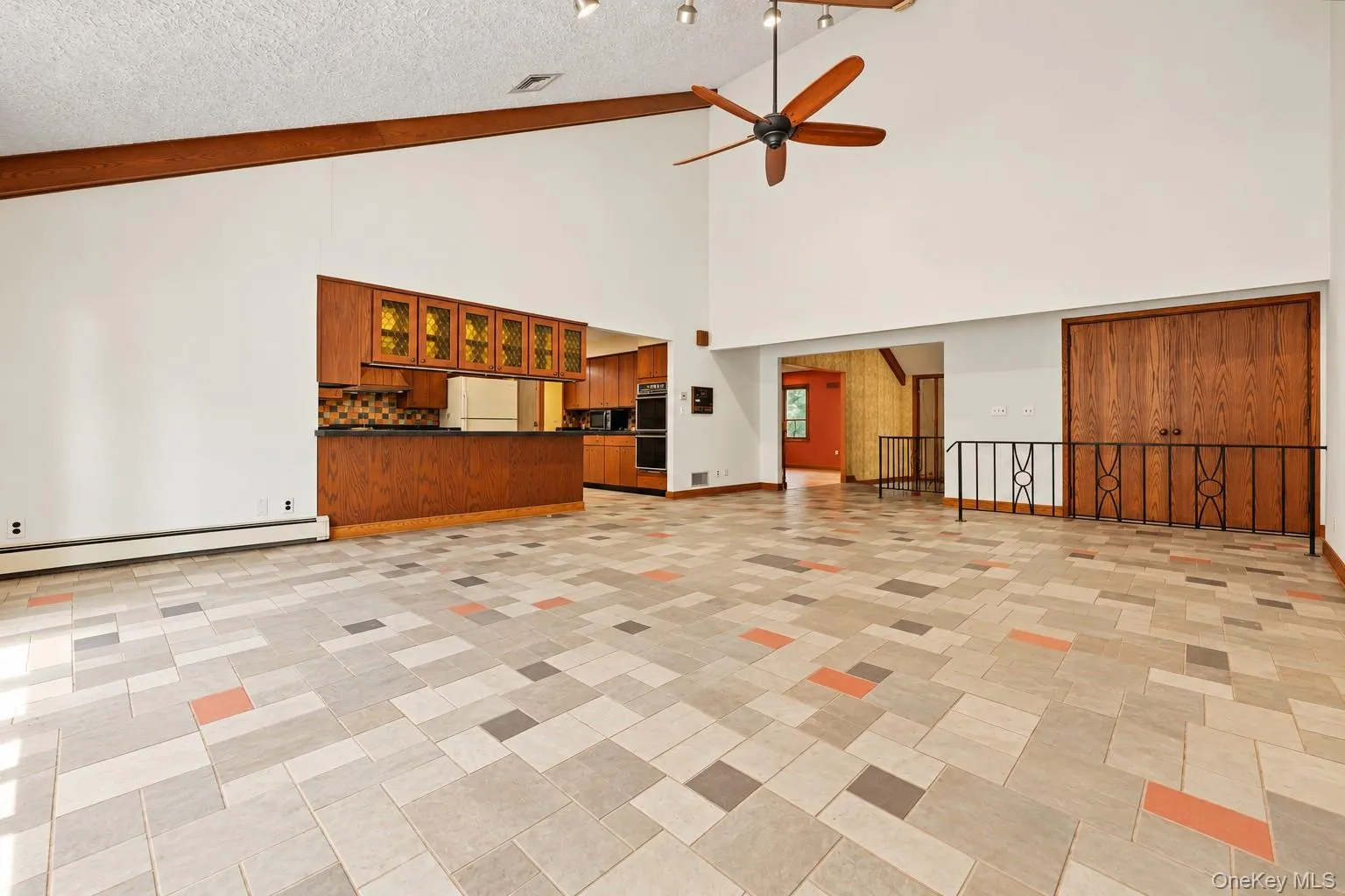 Another view with kitchen on the left, hallway and living room. Another view with kitchen on the left, hallway and living room.