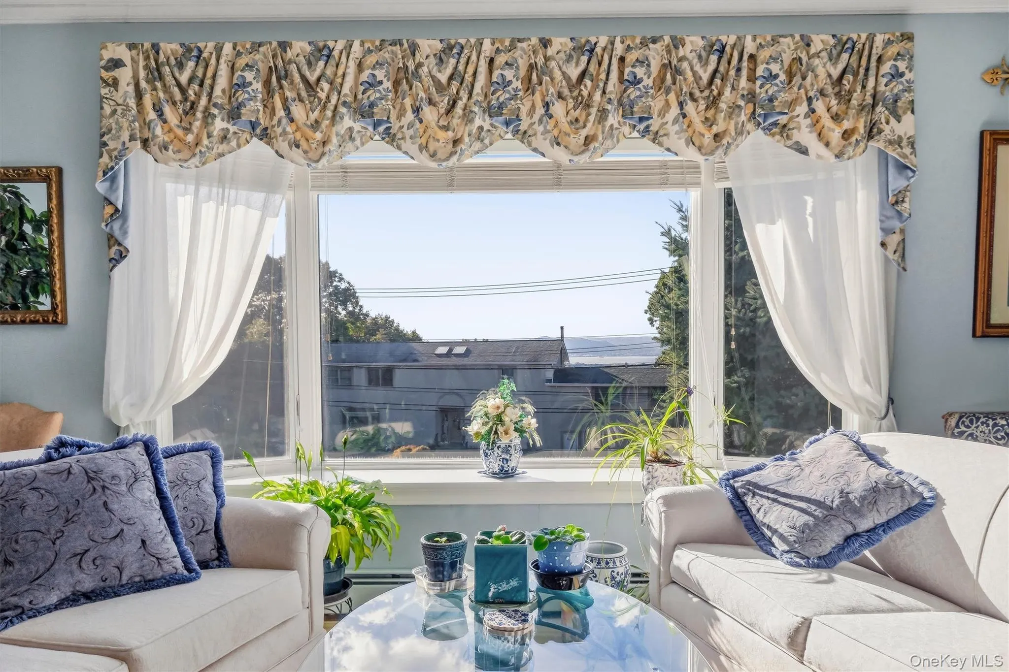 sunlit living area with large picturesque windows sunlit living area with large picturesque windows