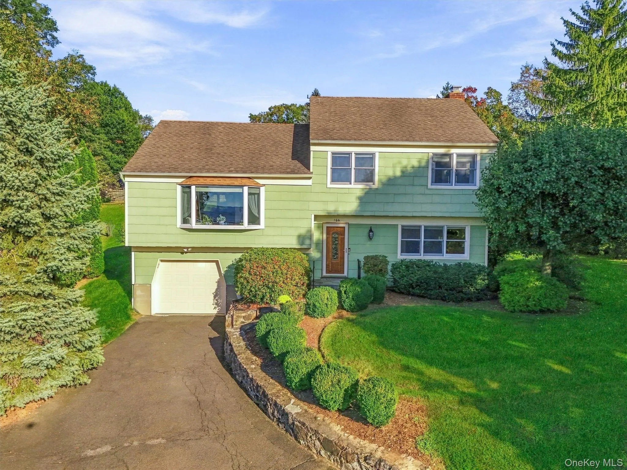 Front view of home with established landscaping Front view of home with established landscaping