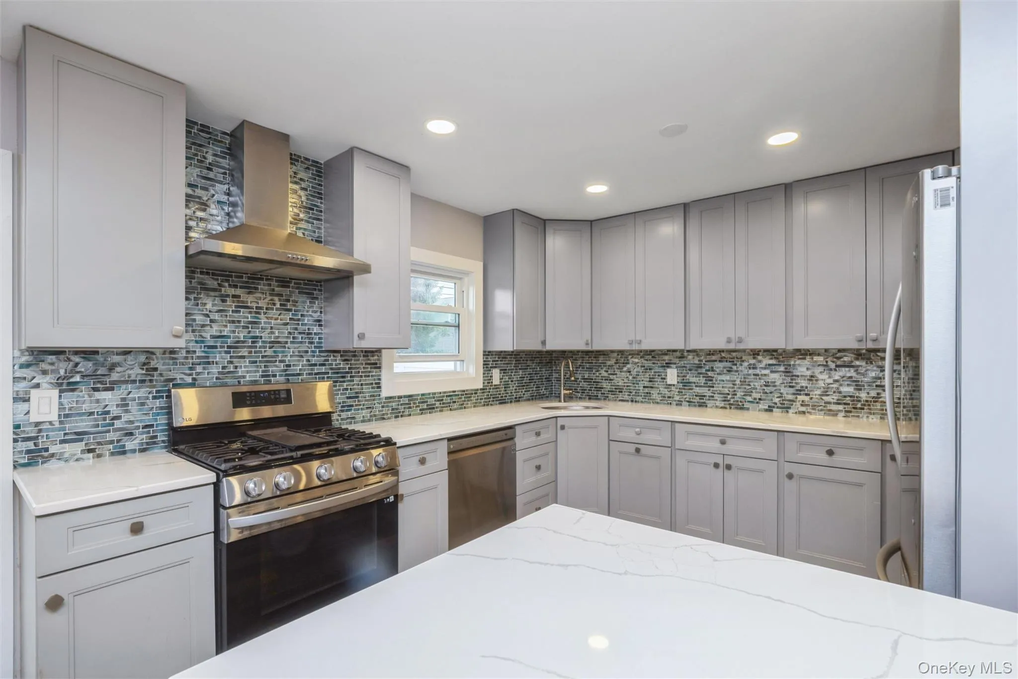 First floor renovated kitchen with quartz counter tops and stainless steel appliances. First floor renovated kitchen with quartz counter tops and stainless steel appliances.
