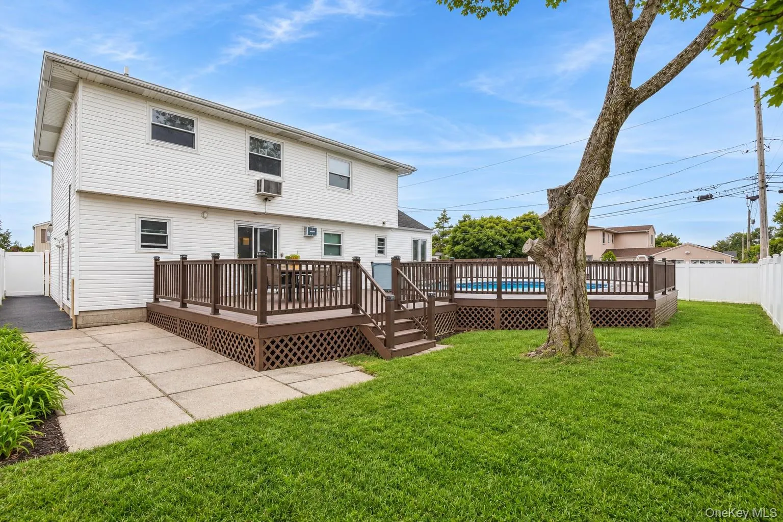Yard spaces around permitted partially inground pool with fence and trek decking surrounding (virtually enhanced) Yard spaces around permitted partially inground pool with fence and trek decking surrounding (virtually enhanced)