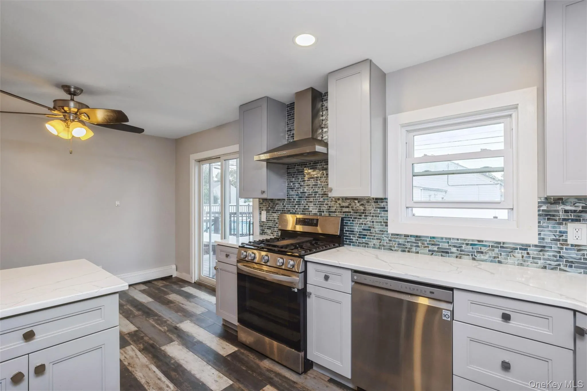 First floor renovated kitchen with quartz counter tops and stainless steel appliances. First floor renovated kitchen with quartz counter tops and stainless steel appliances.