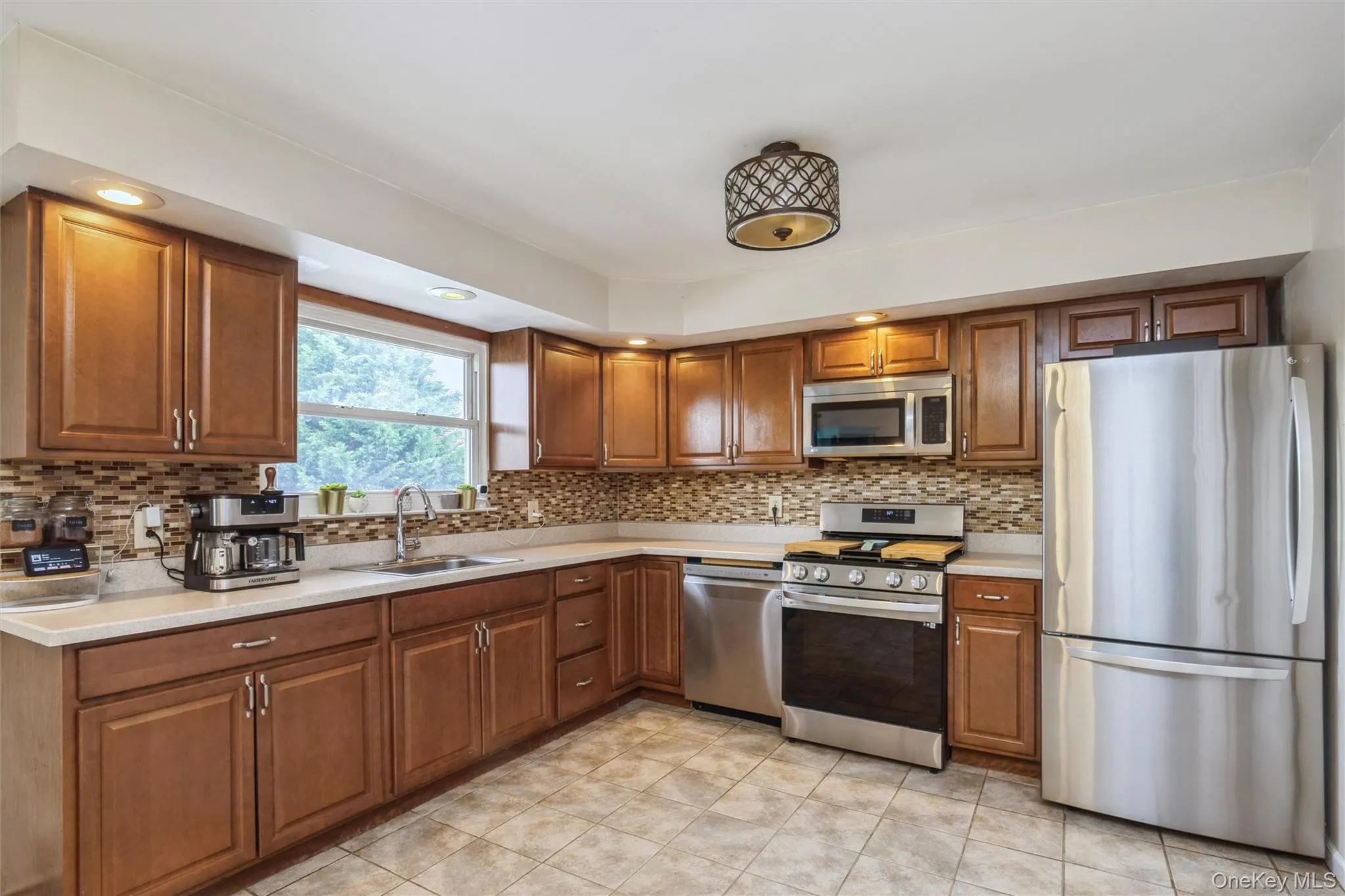 Second floor large kitchen with new stainless steel appliances and huge pantry room. Second floor large kitchen with new stainless steel appliances and huge pantry room.