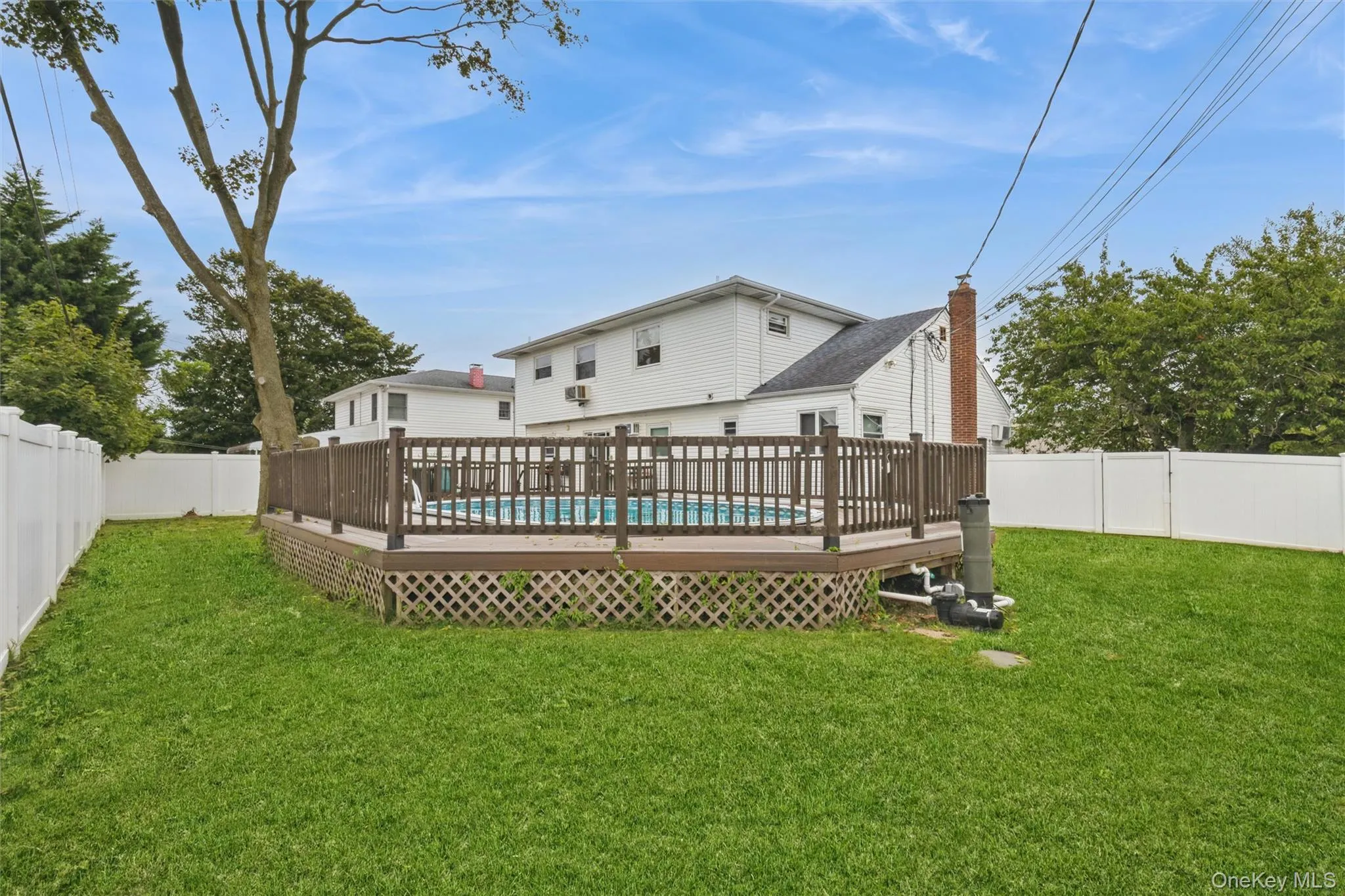 Yard spaces around permitted partially inground pool with fence and trek decking surrounding Yard spaces around permitted partially inground pool with fence and trek decking surrounding