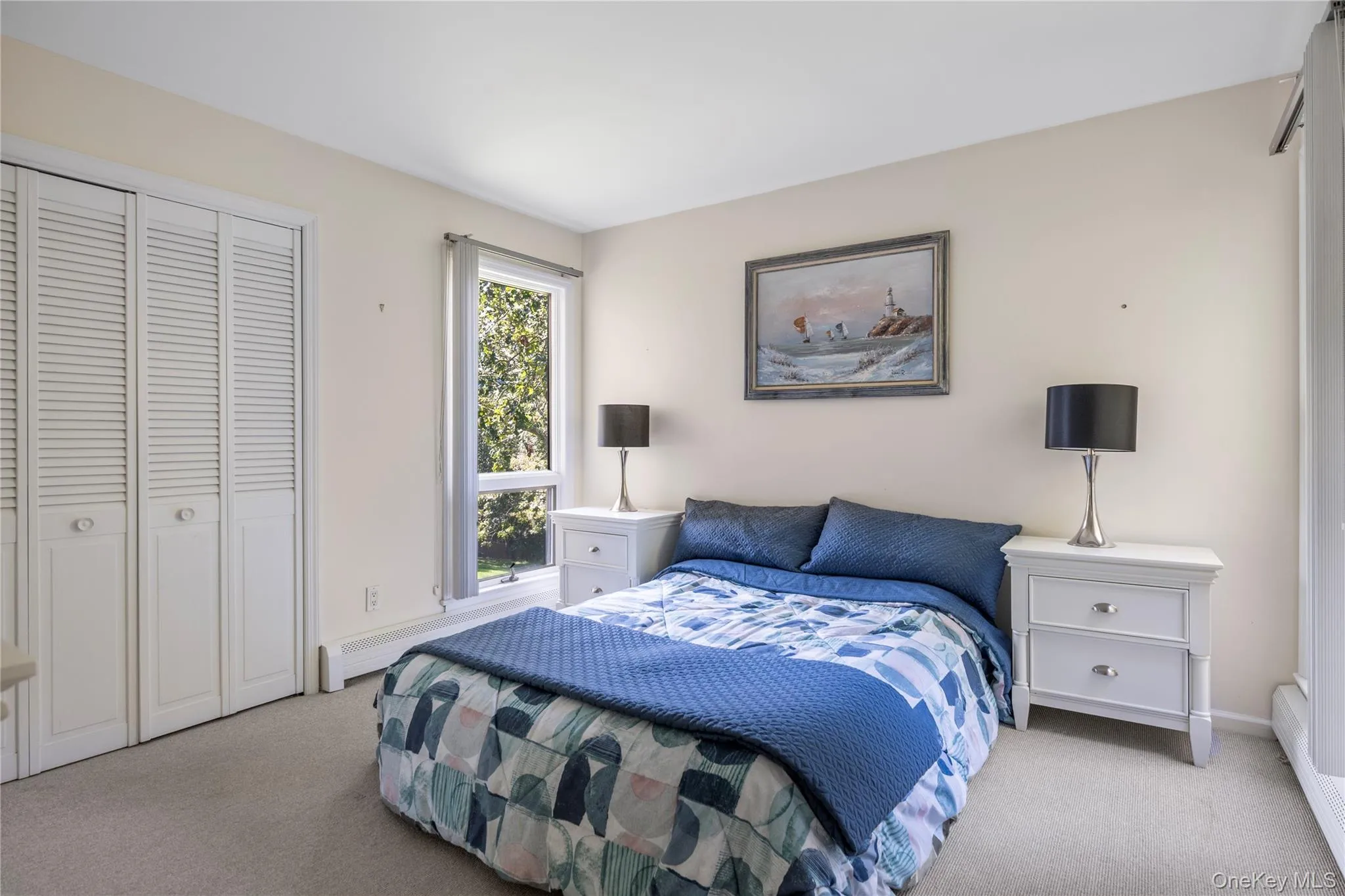 Bedroom with carpet flooring and a closet Bedroom with carpet flooring and a closet