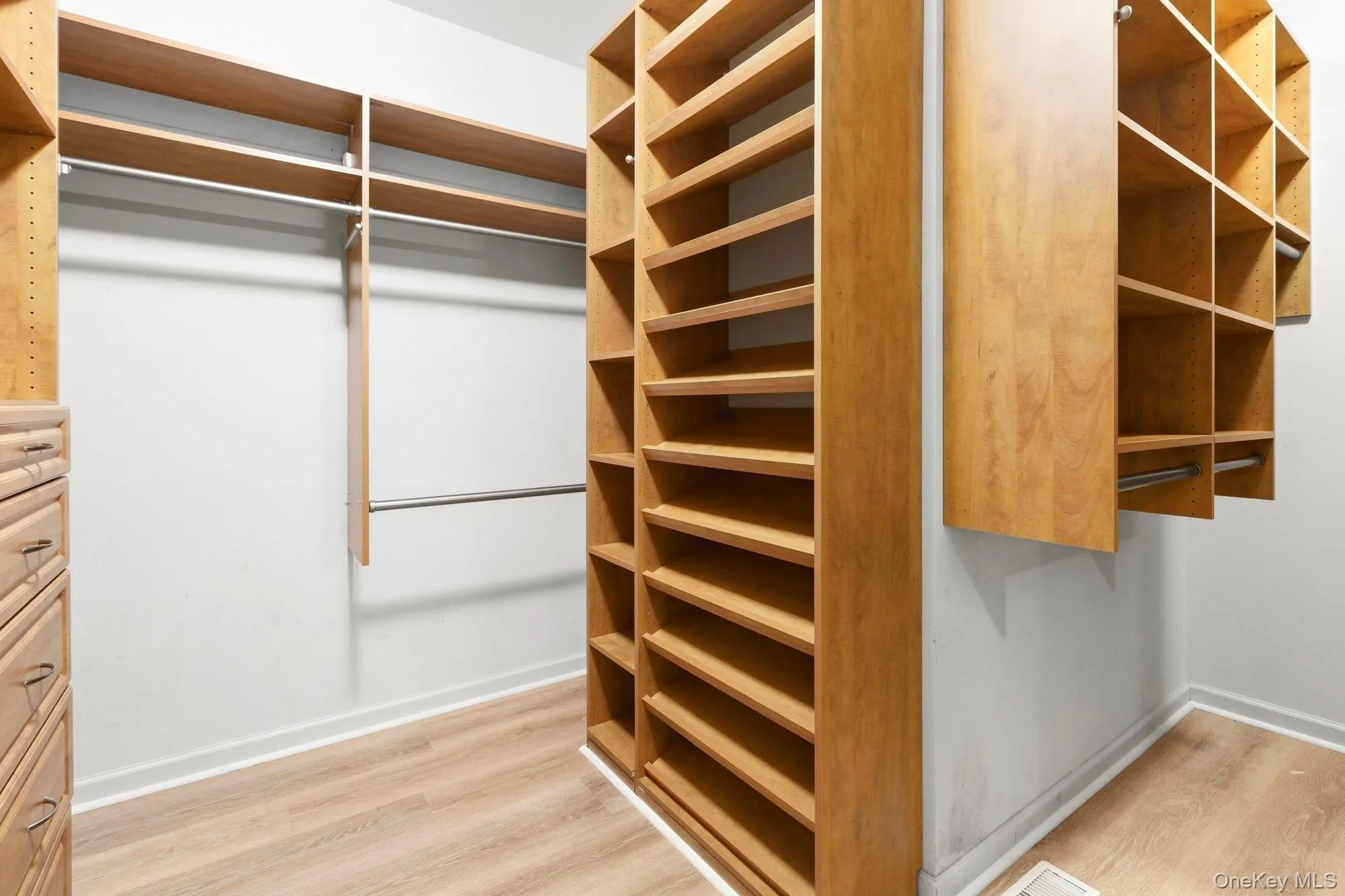 Large walk- in with custom built ins. Plenty of drawers, hanging and shelves Large walk- in with custom built ins. Plenty of drawers, hanging and shelves