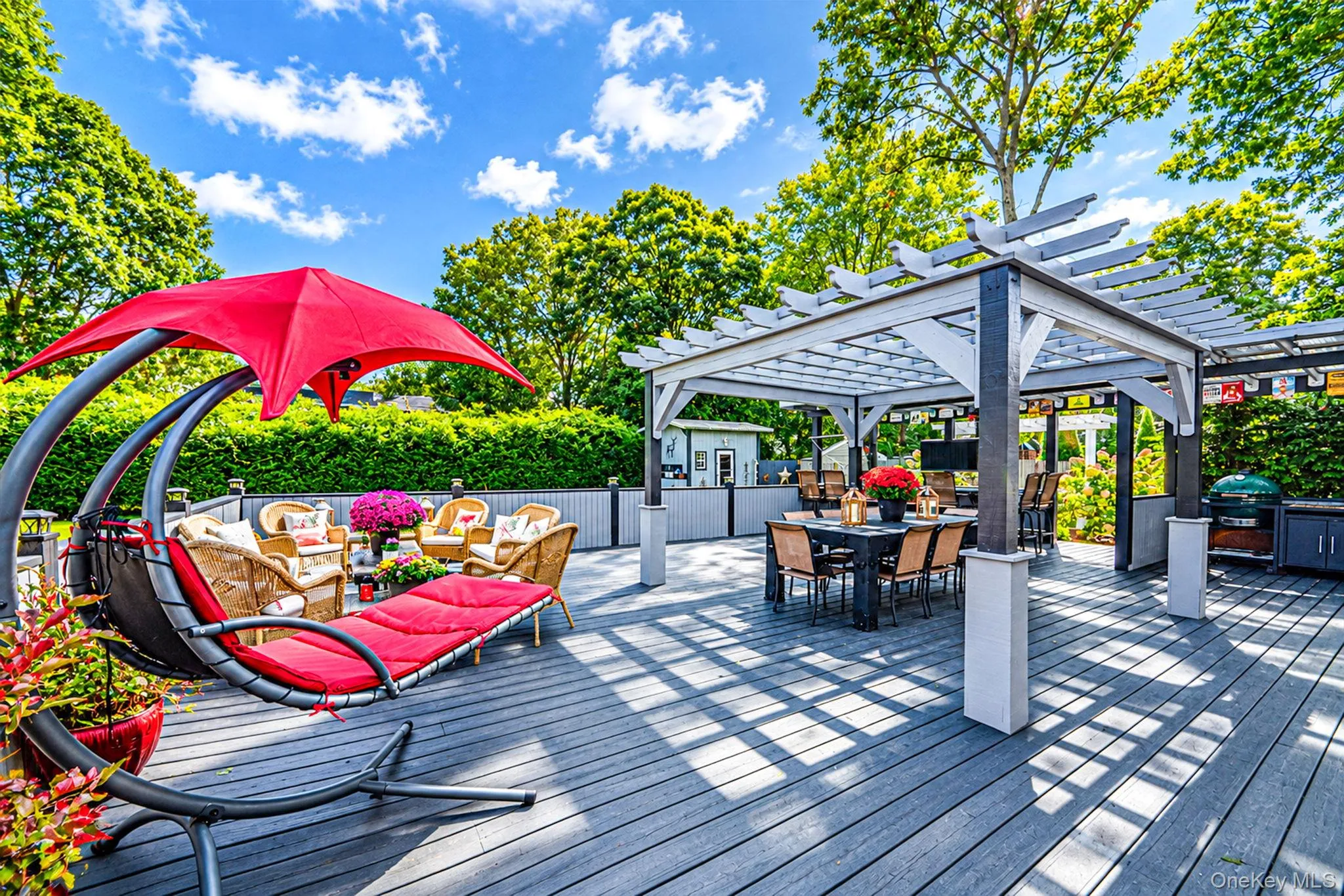 Spacious Deck with Multiple Seating Areas, Pergola, Outdoor Bar with Beverage Fridges, Storage, Outdoor TV Spacious Deck with Multiple Seating Areas, Pergola, Outdoor Bar with Beverage Fridges, Storage, Outdoor TV