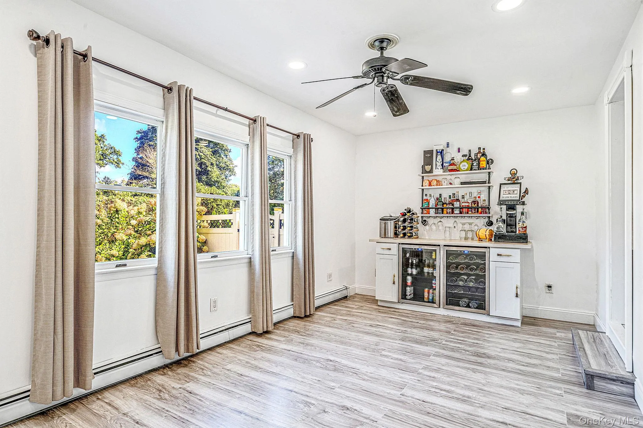 Den with New Vinyl Flooring, Recessed Lighting, Built in Bar with 2 Beverage Fridges Den with New Vinyl Flooring, Recessed Lighting, Built in Bar with 2 Beverage Fridges