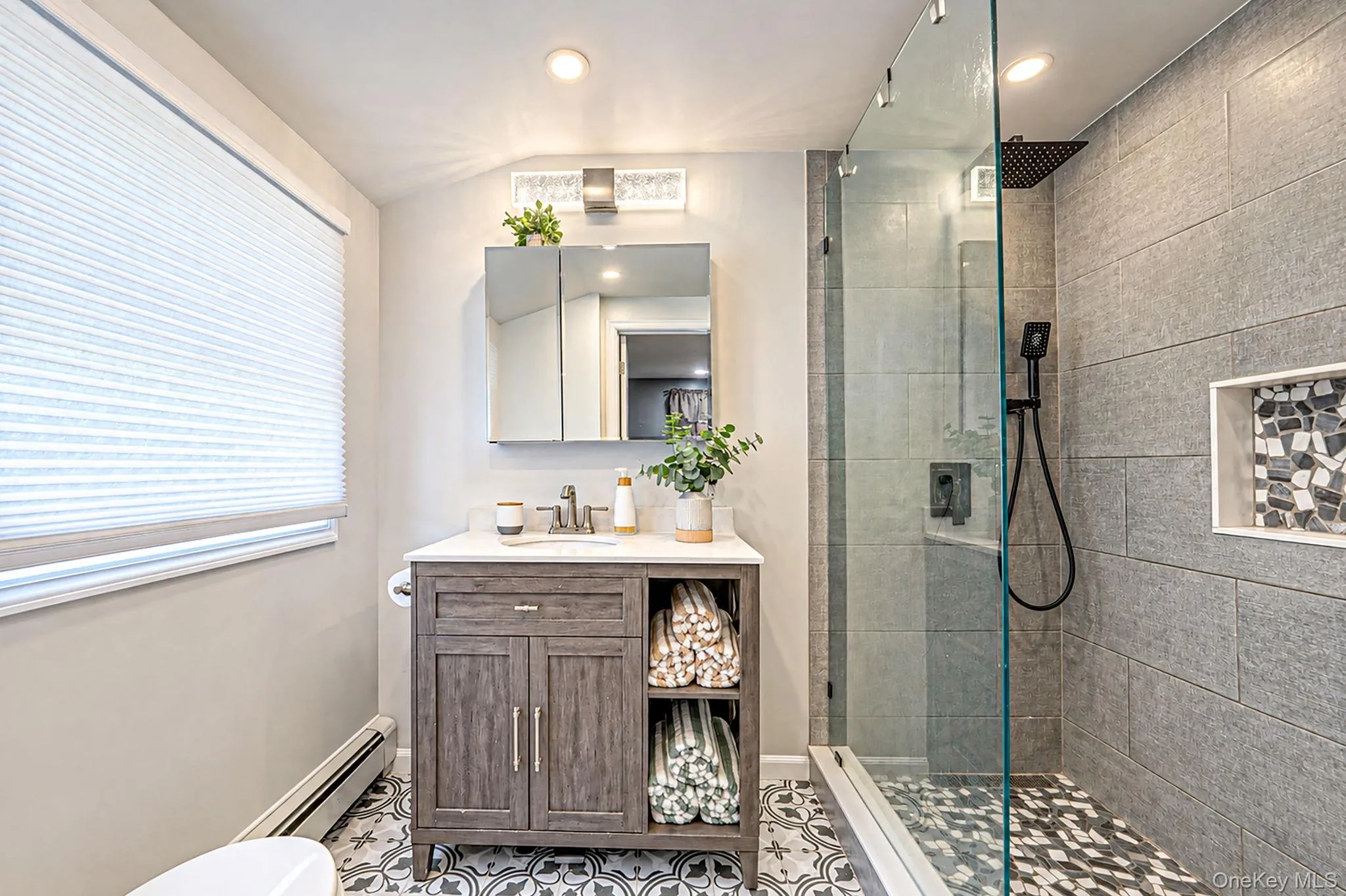 Newly Renovated Primary Bathroom, Walk In Shower, Stamped Tile Flooring Newly Renovated Primary Bathroom, Walk In Shower, Stamped Tile Flooring