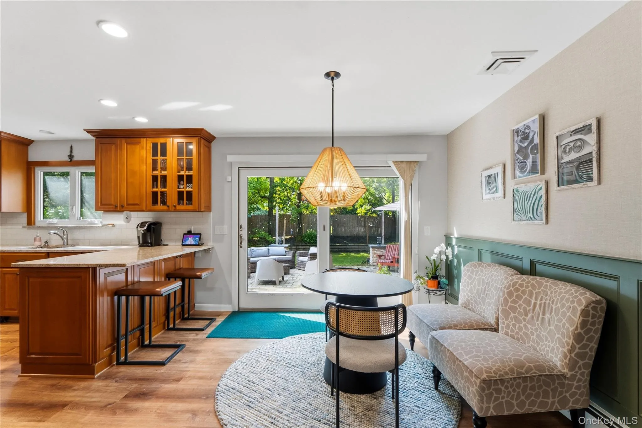 Eat-in Area of Kitchen with Sliders to Backyard Eat-in Area of Kitchen with Sliders to Backyard