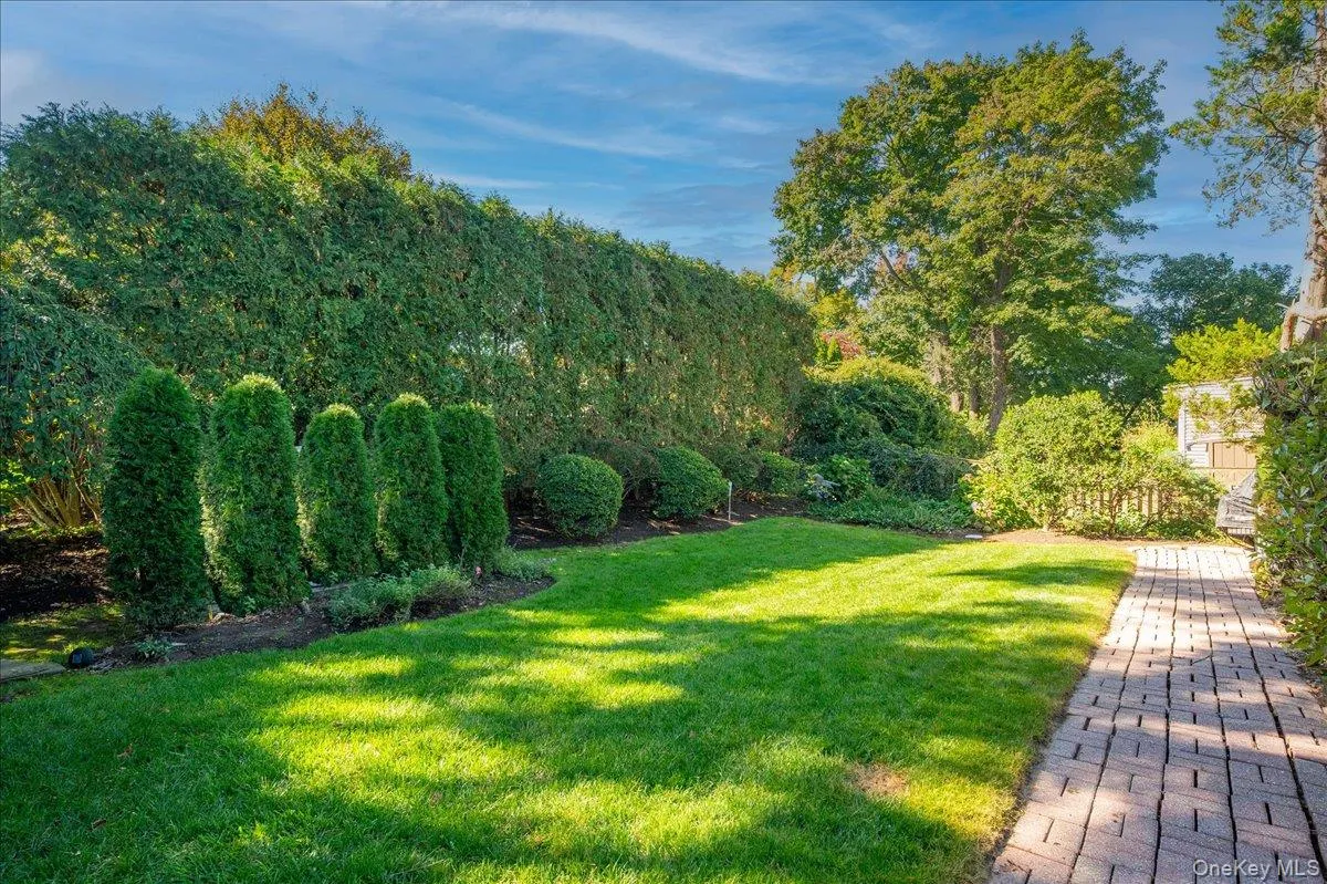Brick walkway to a private and perfectly manicured yard Brick walkway to a private and perfectly manicured yard