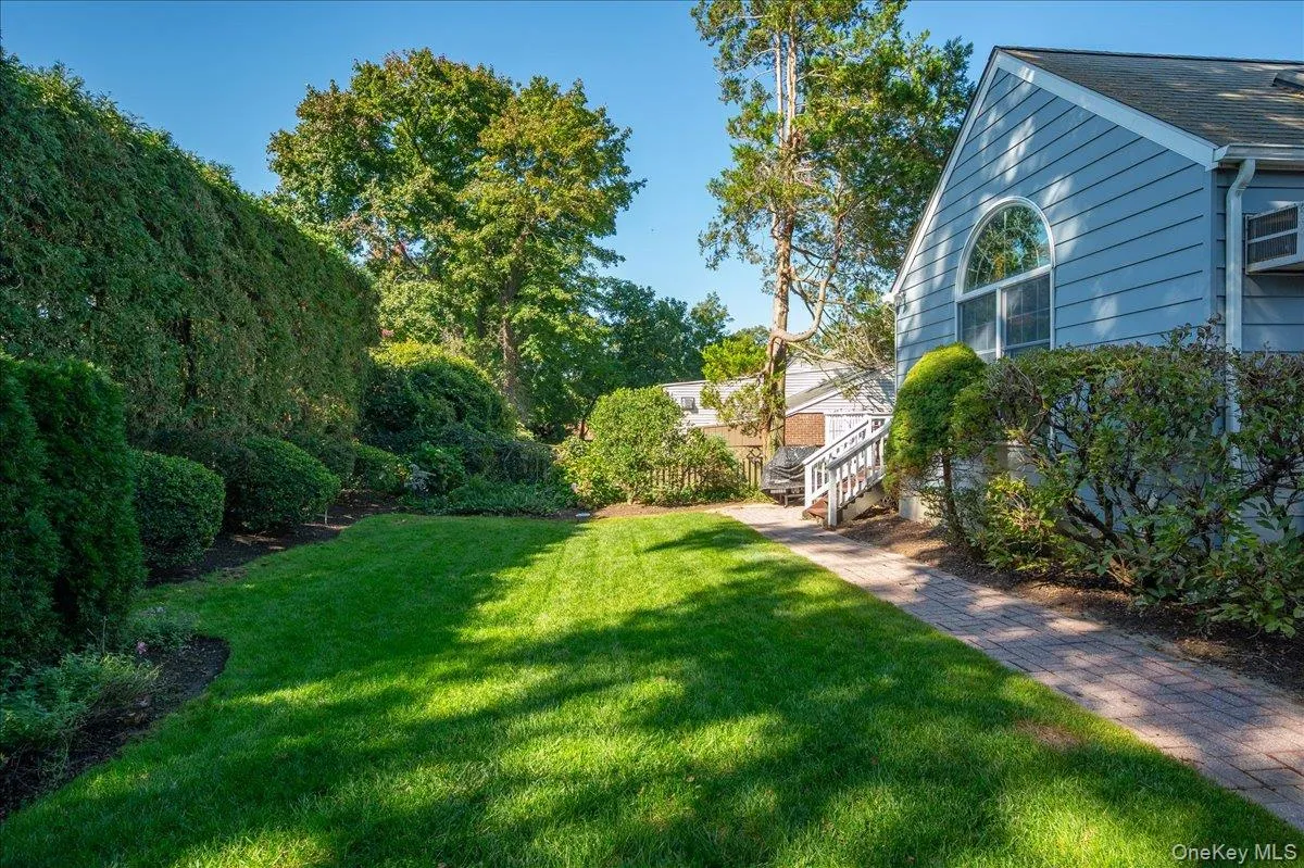 Mature trees and vibrant greenery transform this outdoor space into a serene sanctuary. Mature trees and vibrant greenery transform this outdoor space into a serene sanctuary.