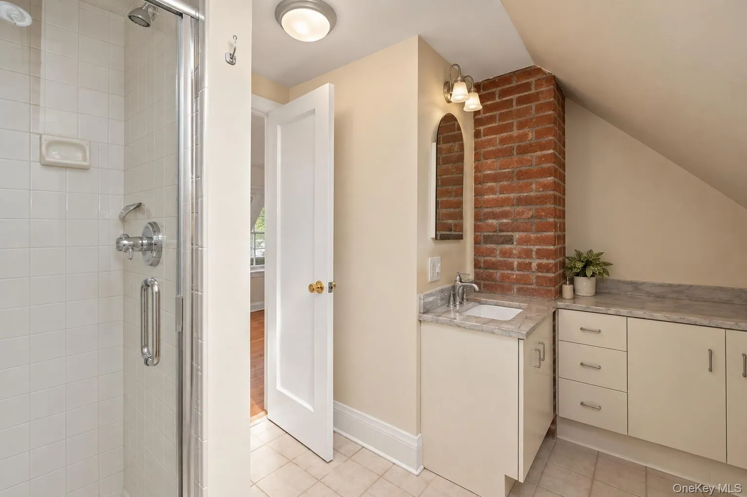 Bathroom on the 2nd floor with stone countertops and skylight. Bathroom on the 2nd floor with stone countertops and skylight.