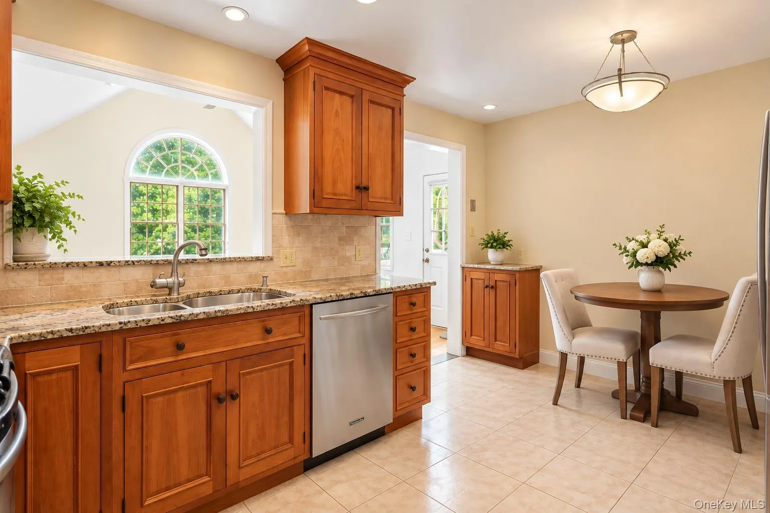 Eat-in-kitchen showing the double sink and breakfast bar. Eat-in-kitchen showing the double sink and breakfast bar.