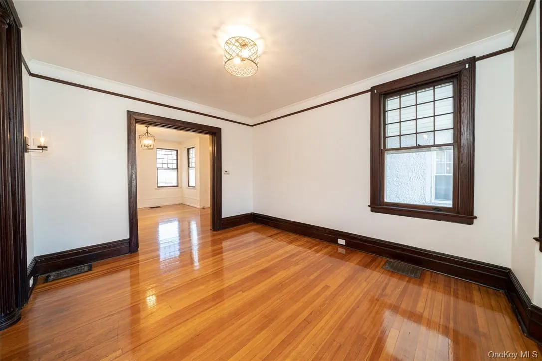 Formal Living Room with high ceilings, refinished hardwood floors throughout and freshly painted. Formal Living Room with high ceilings, refinished hardwood floors throughout and freshly painted.