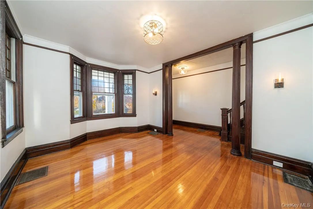 Formal Living Room with a view into the Entry Foyer. Freshly painted throughout, refinished hardwood floors with all new light fixtures! Formal Living Room with a view into the Entry Foyer. Freshly painted throughout, refinished hardwood floors with all new light fixtures!