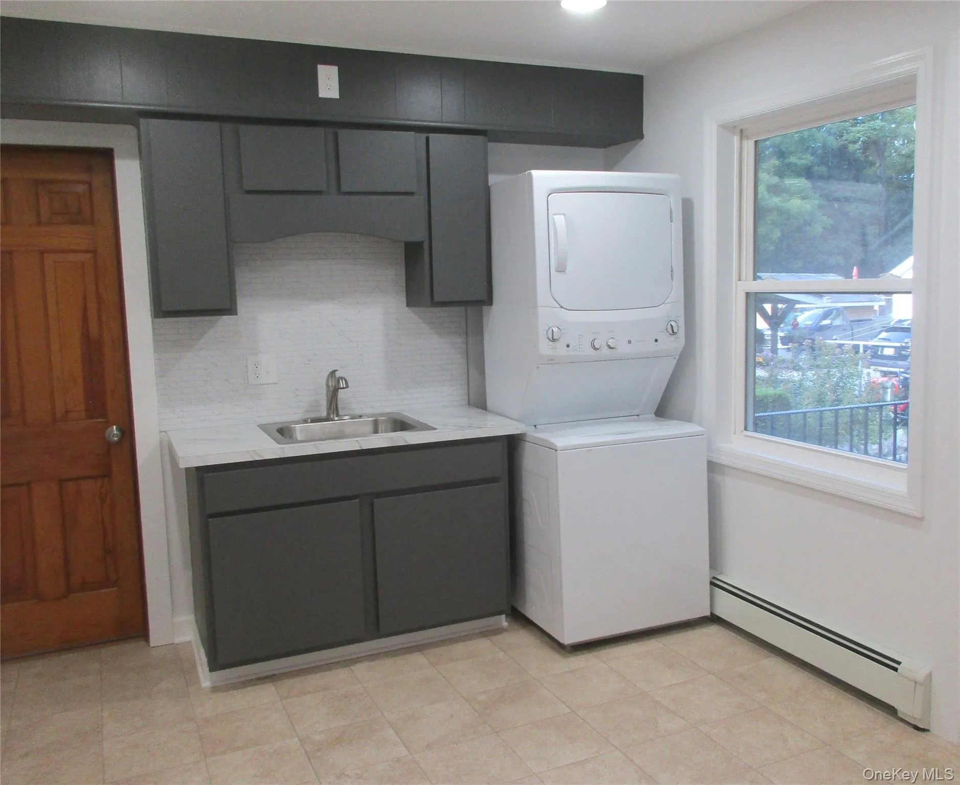 w/dryer and updated cabinets and sink. w/dryer and updated cabinets and sink.