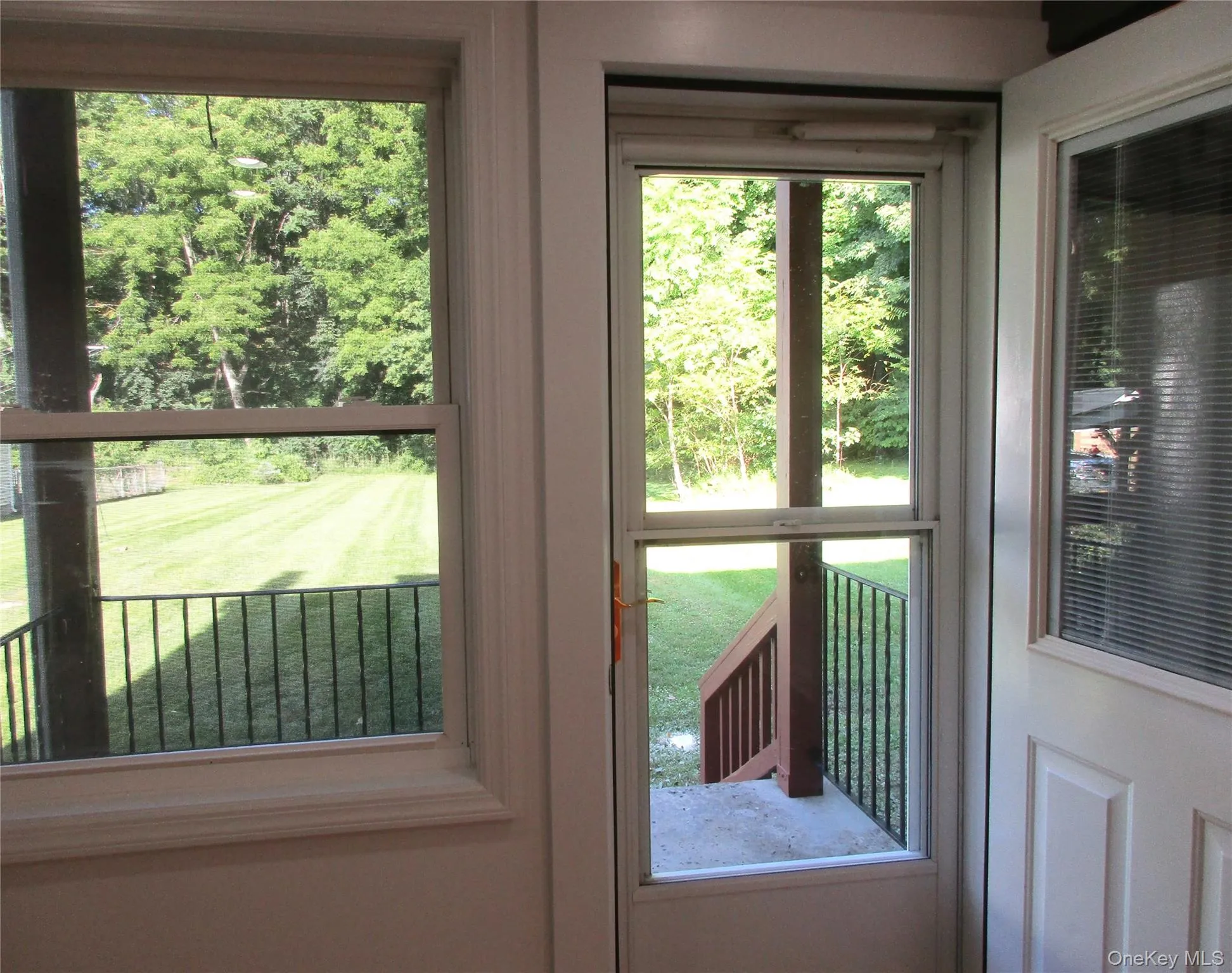 Door open to back porch and yard Door open to back porch and yard