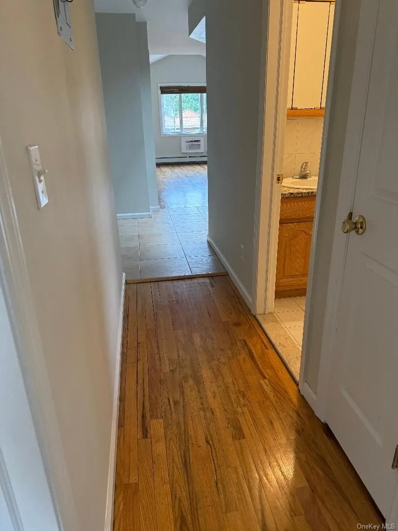 Hall/2nd bathroom kitchen/living room view Hall/2nd bathroom kitchen/living room view
