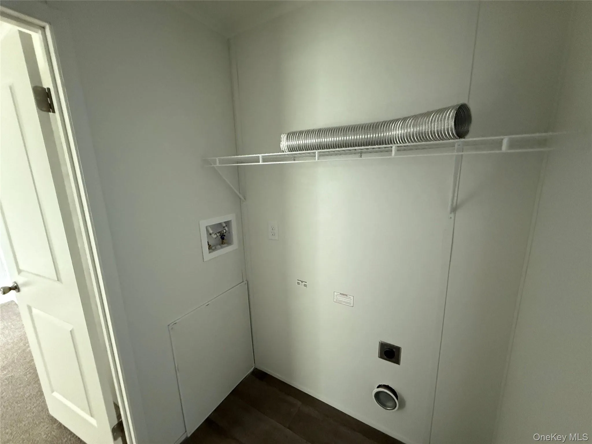 Washroom featuring hookup for a washing machine and hookup for an electric dryer Washroom featuring hookup for a washing machine and hookup for an electric dryer