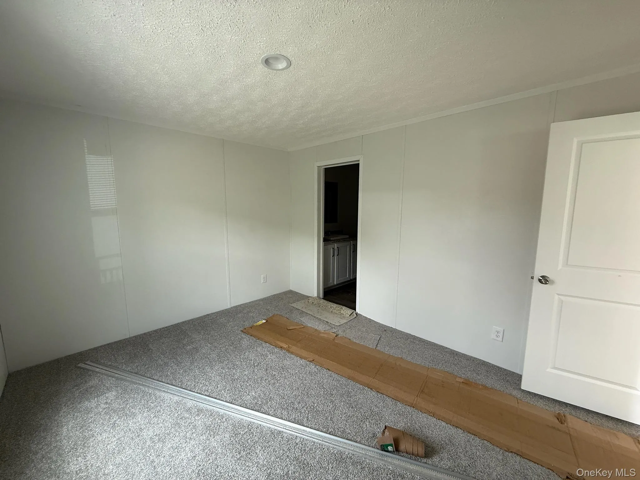 Spare room featuring a textured ceiling Spare room featuring a textured ceiling