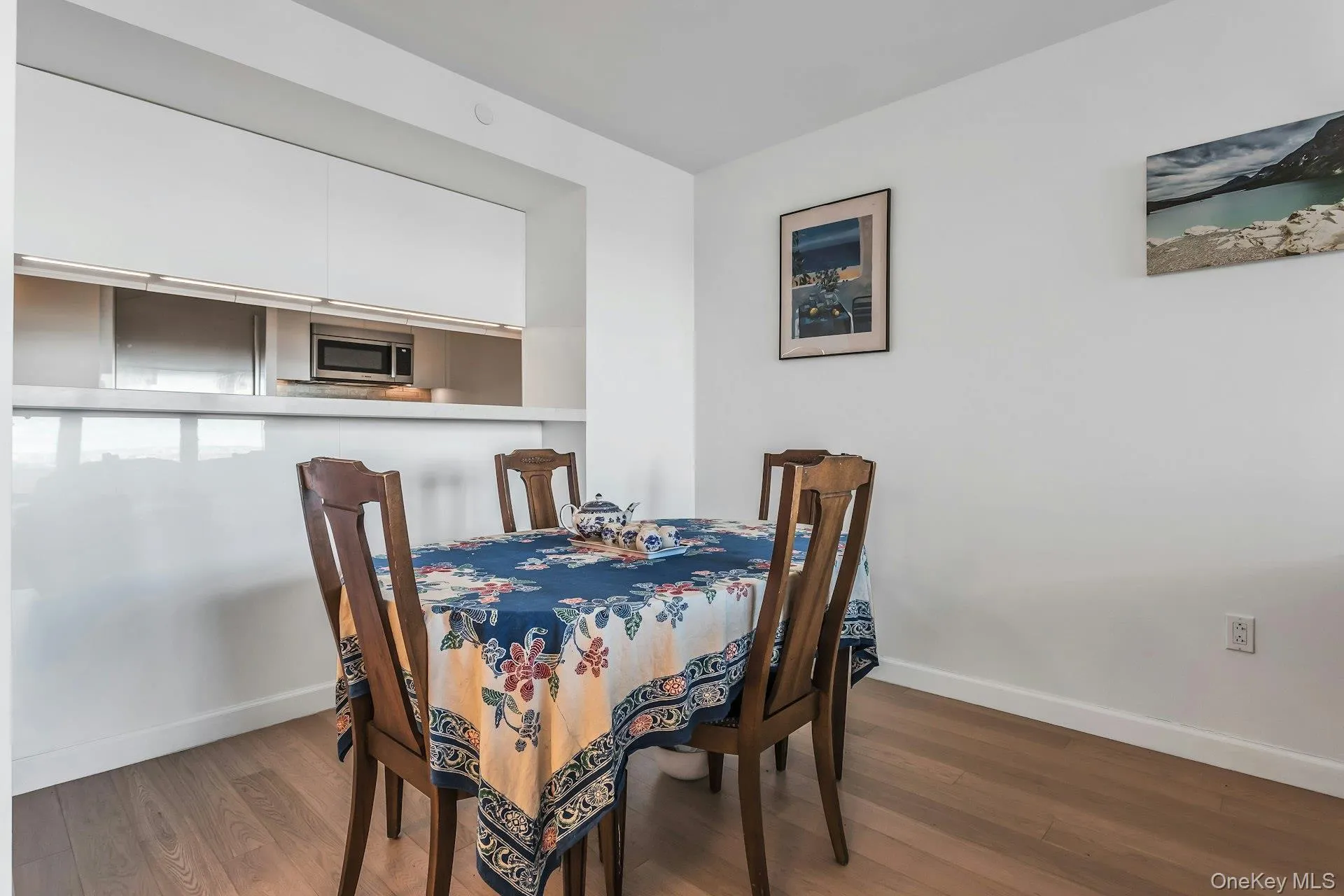Dining space featuring dark wood-style floors Dining space featuring dark wood-style floors