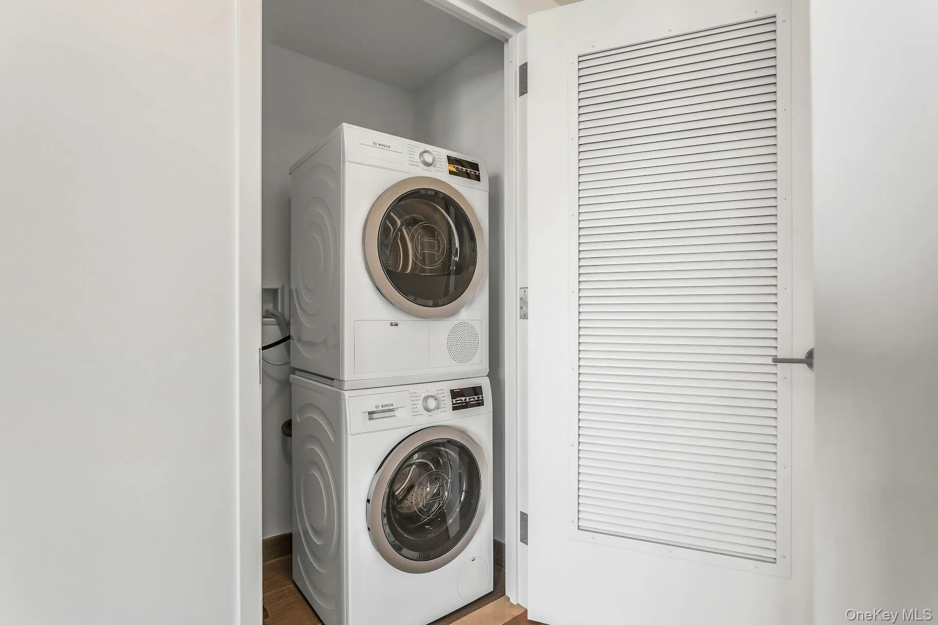 Washroom featuring estacked washer and dryer Washroom featuring estacked washer and dryer