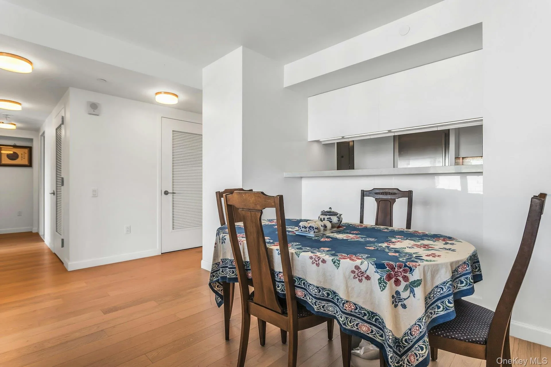 Dining space with light wood-type flooring and baseboards Dining space with light wood-type flooring and baseboards