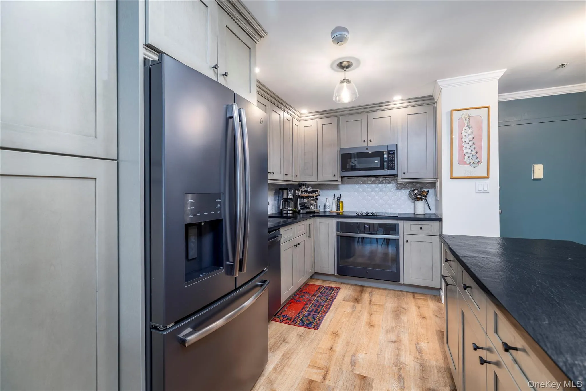 Newly updated kitchen with stainless steel appliances and oversized island Newly updated kitchen with stainless steel appliances and oversized island