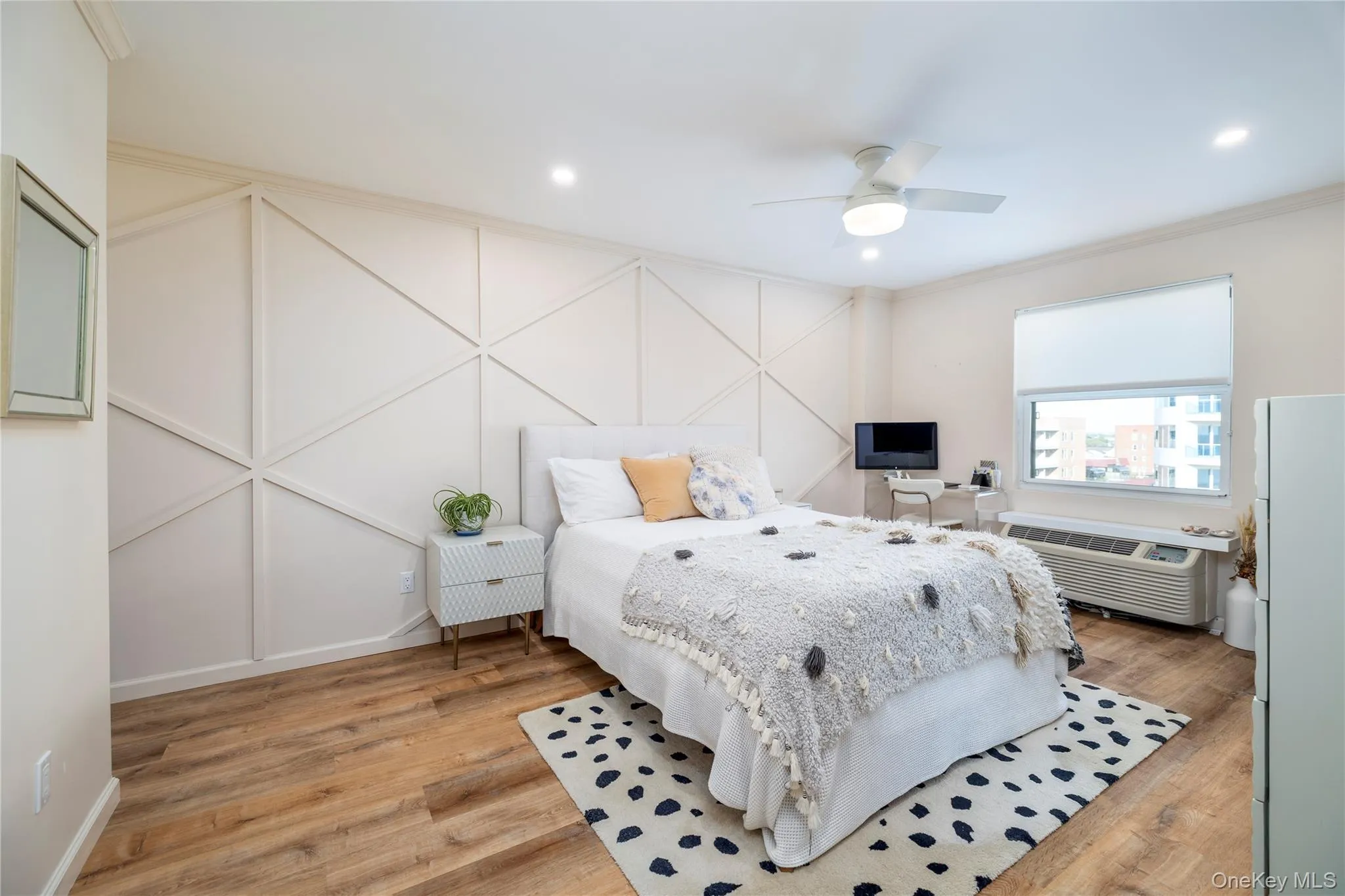 Large bedroom with recessed lighting, ceiling fan, and views of the ocean from bed Large bedroom with recessed lighting, ceiling fan, and views of the ocean from bed