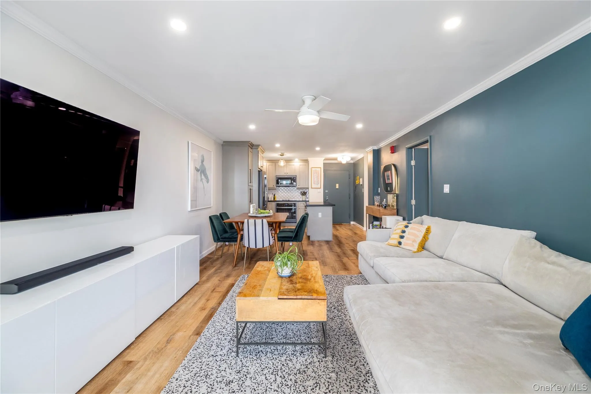 Open living area with ample space for lounging, cooking, and entertaining Open living area with ample space for lounging, cooking, and entertaining