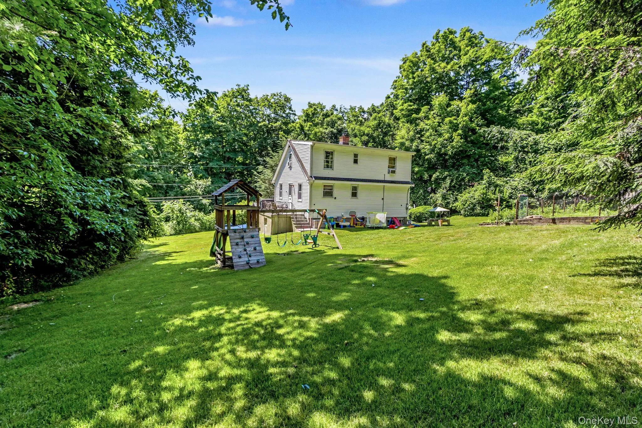 Rear exterior overlooking the backyard. Rear exterior overlooking the backyard.