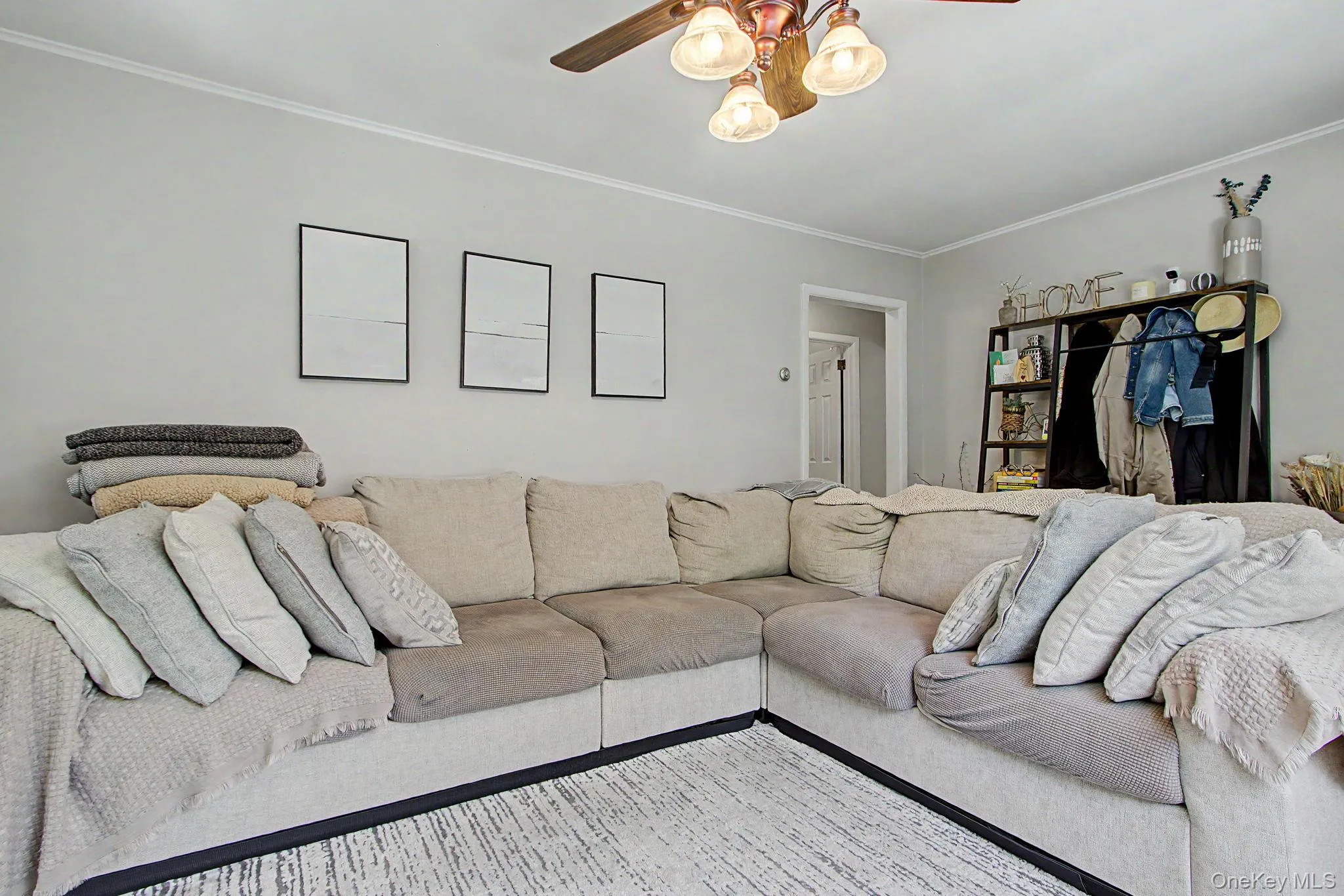 Living Room featuring hardwood floors and crown molding. Living Room featuring hardwood floors and crown molding.