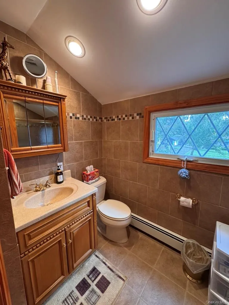 Hall bath upstairs, shower, toilet, sink, lovely window Hall bath upstairs, shower, toilet, sink, lovely window
