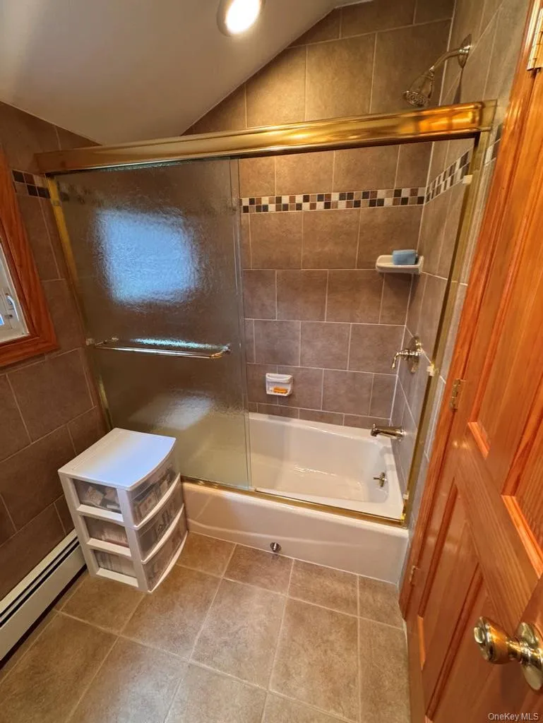 Full bath upstairs, with tub and shower, glass enclosure Full bath upstairs, with tub and shower, glass enclosure