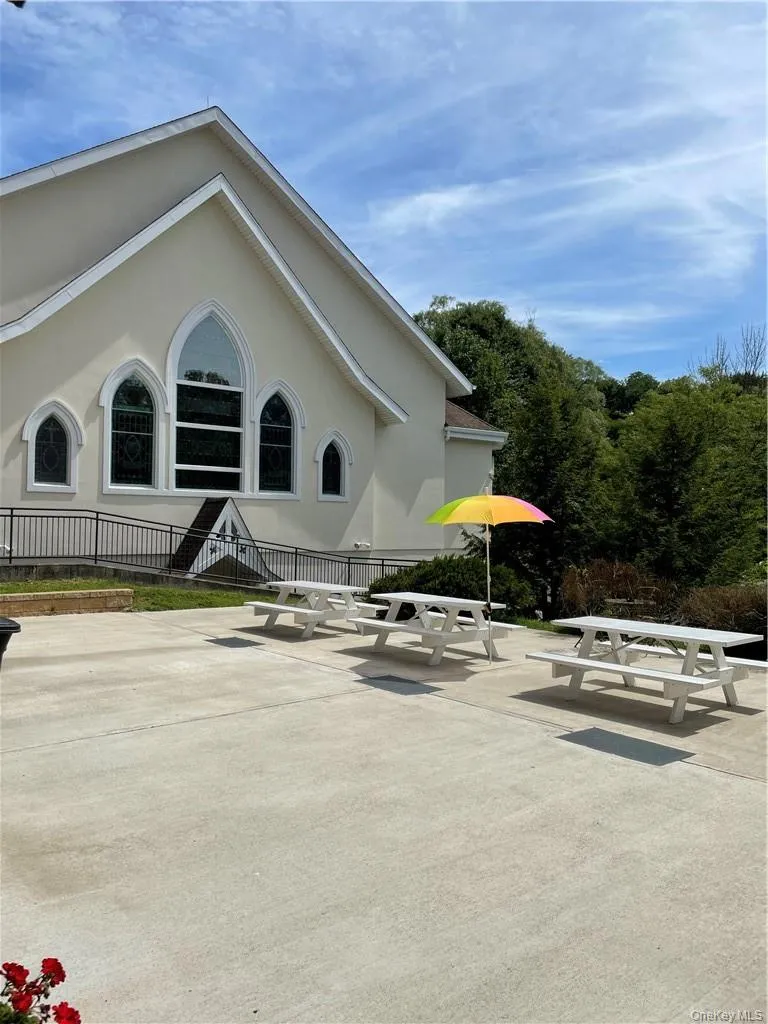 The private area behind the building has outdoor patio furniture for the tenants enjoyment. The private area behind the building has outdoor patio furniture for the tenants enjoyment.