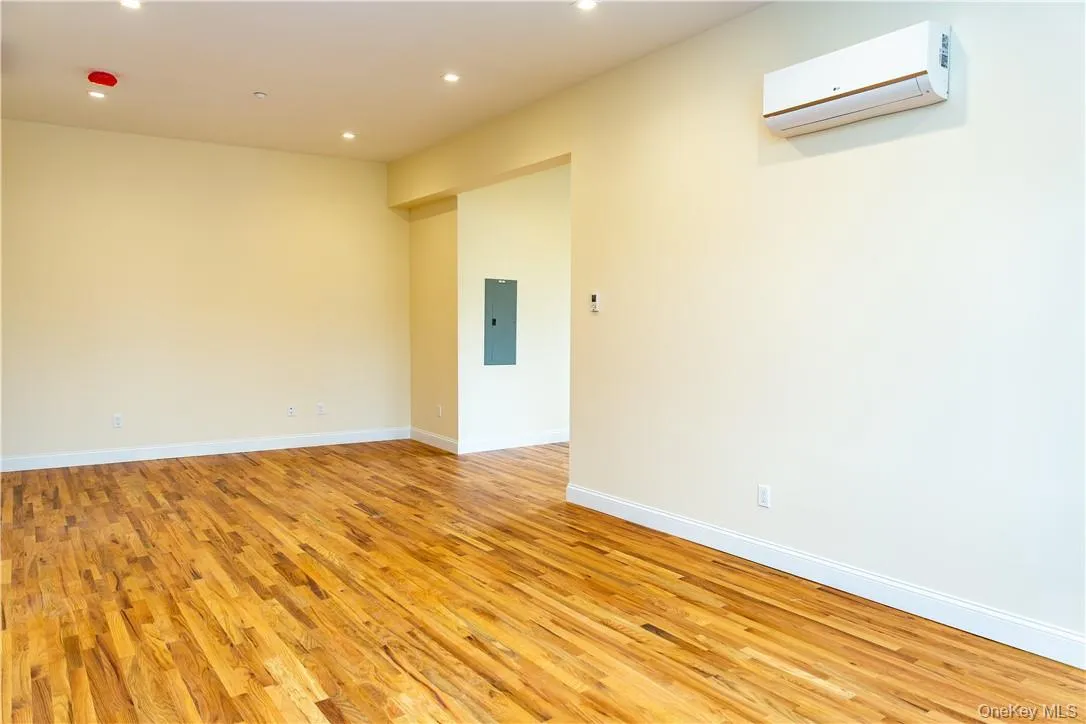 Generously sized room with high ceilings and recessed lights. Generously sized room with high ceilings and recessed lights.