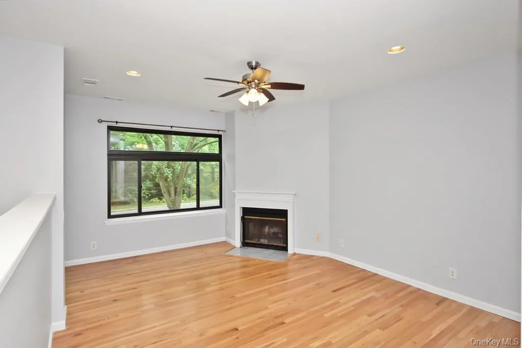 Large sunken living room with wood burning fireplace. Large sunken living room with wood burning fireplace.