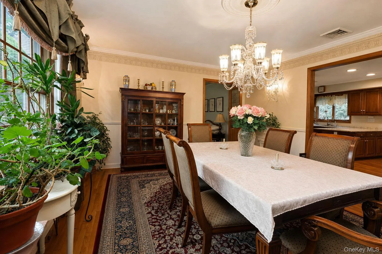 Hardwood flooring, decorative wall molding, crystal chandelier, built-in display cabinetry, large window and custom stenciling Hardwood flooring, decorative wall molding, crystal chandelier, built-in display cabinetry, large window and custom stenciling