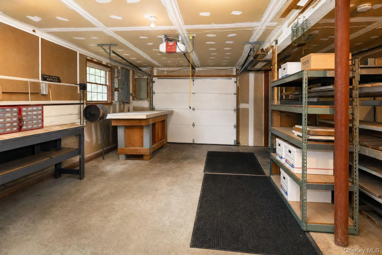 3 car garage with tool bench, electric panel and garage door openers 3 car garage with tool bench, electric panel and garage door openers