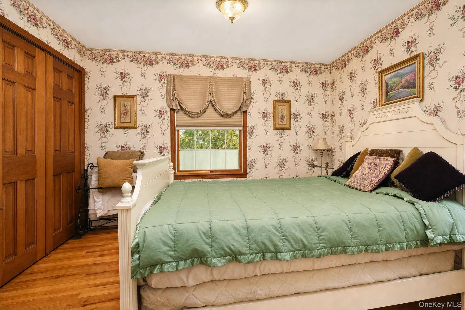 Hardwood flooring with a satin finish, dual windows and large closet with 6 panel wood doors Hardwood flooring with a satin finish, dual windows and large closet with 6 panel wood doors