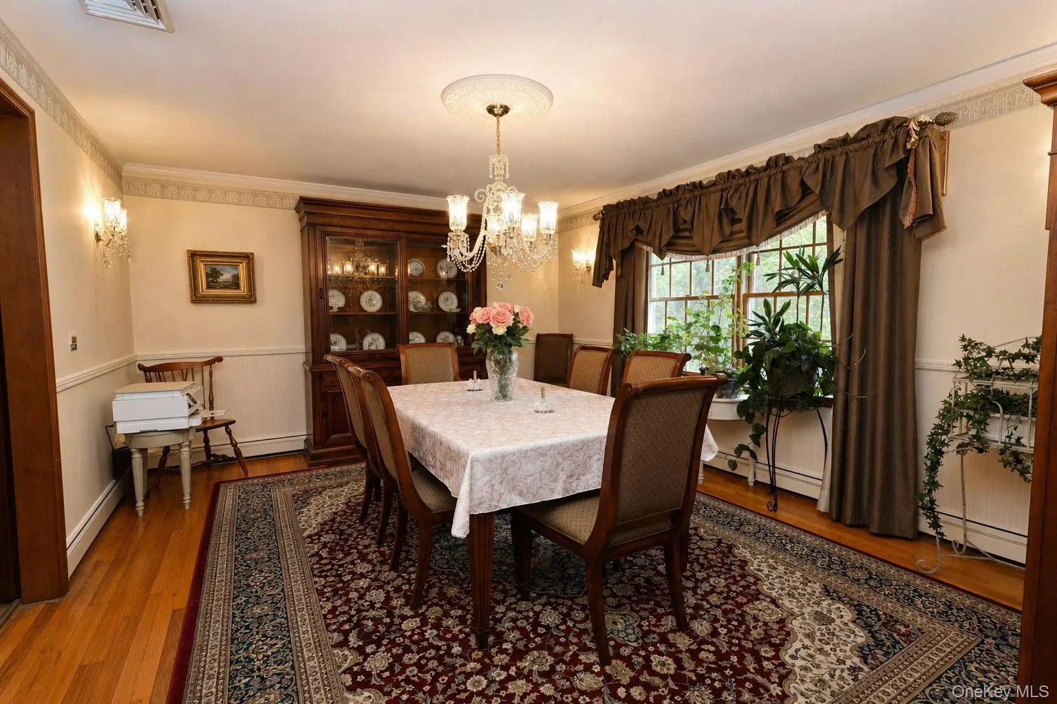 Hardwood flooring, dual windows, chandelier with ceiling medallion, wall sconces, crown molding and custom stenciling Hardwood flooring, dual windows, chandelier with ceiling medallion, wall sconces, crown molding and custom stenciling