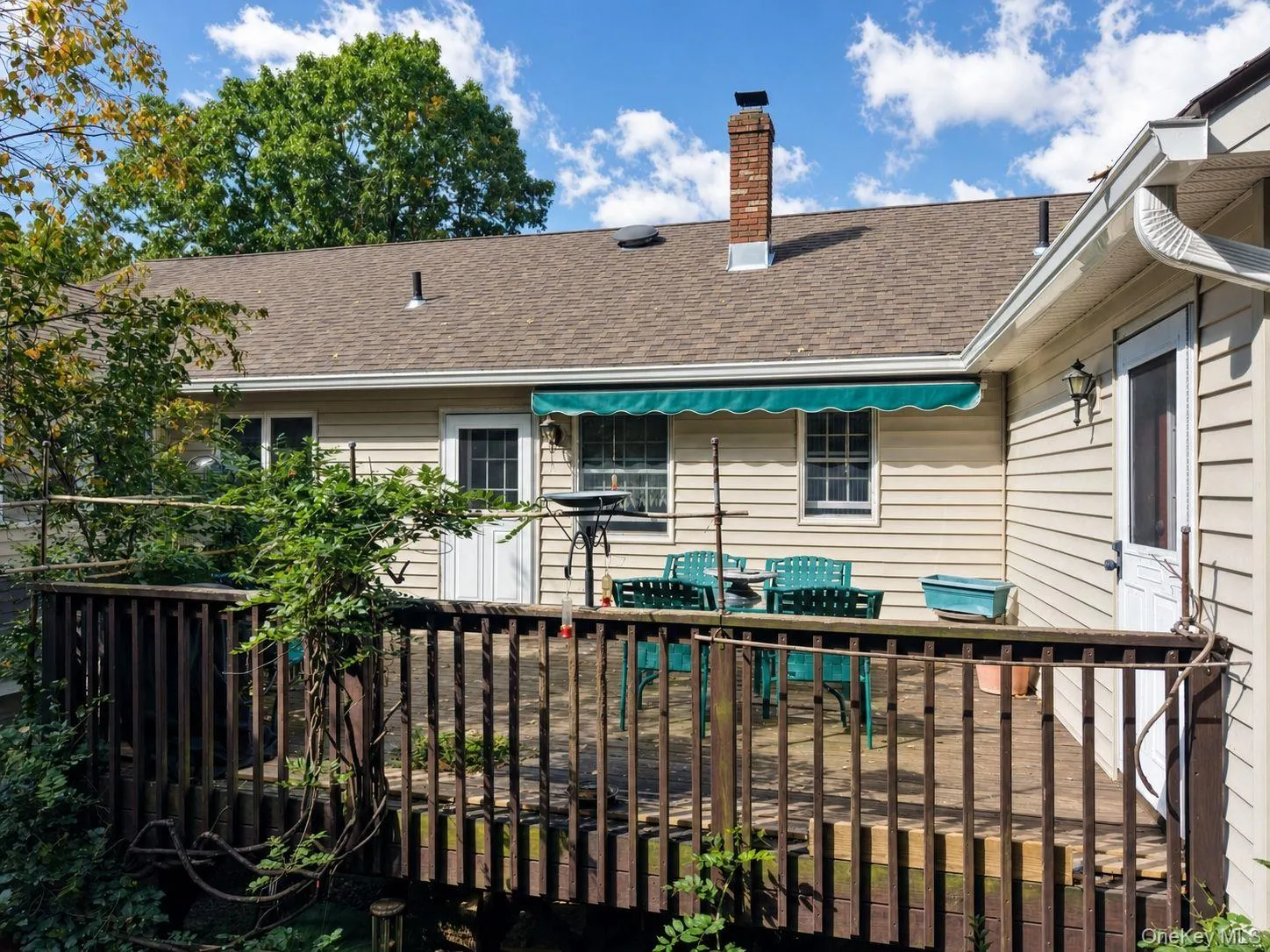 Rear deck with two entrances to the house and steps to the rear yard Rear deck with two entrances to the house and steps to the rear yard
