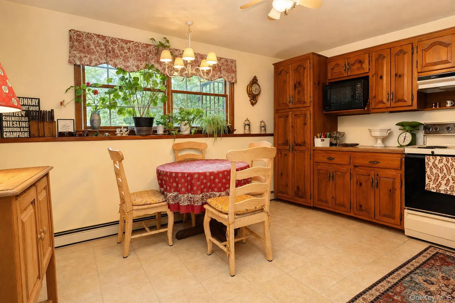 Second kitchen for mom with dual windows, custom cabinetry with pull oput shelving and dining area Second kitchen for mom with dual windows, custom cabinetry with pull oput shelving and dining area