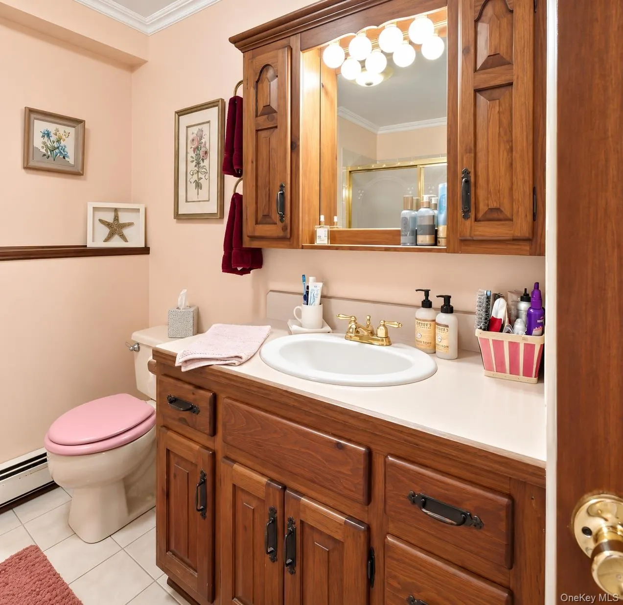 Wood-finish vanity with ample storage, integrated countertop, and an oval basin Wood-finish vanity with ample storage, integrated countertop, and an oval basin