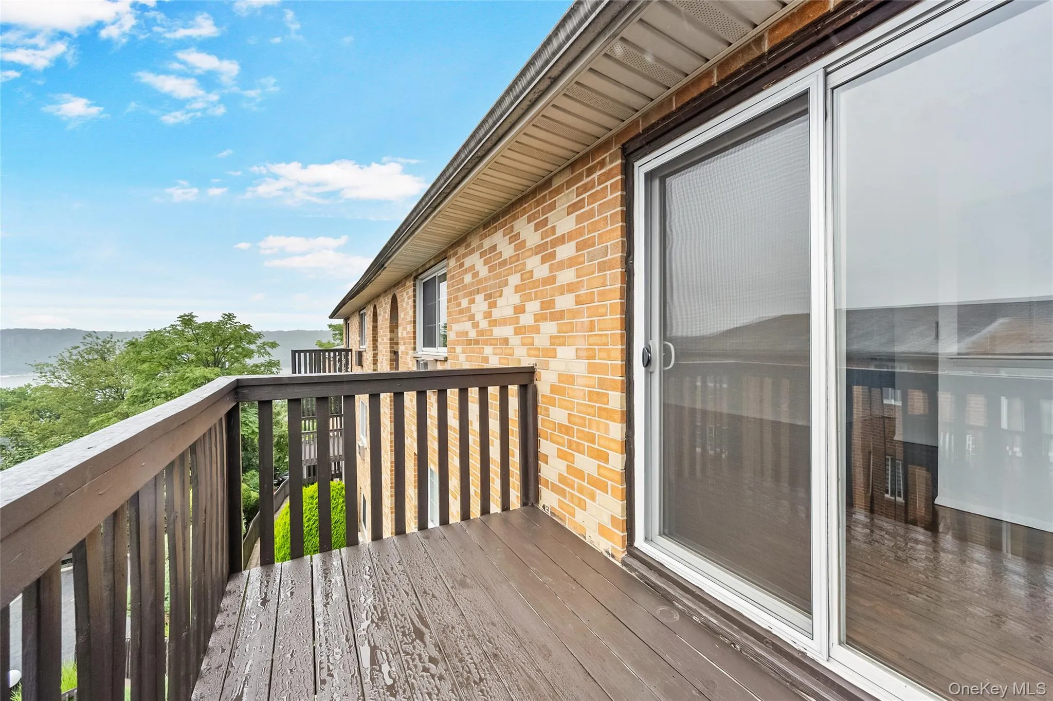 Wooden terrace featuring a water view Wooden terrace featuring a water view