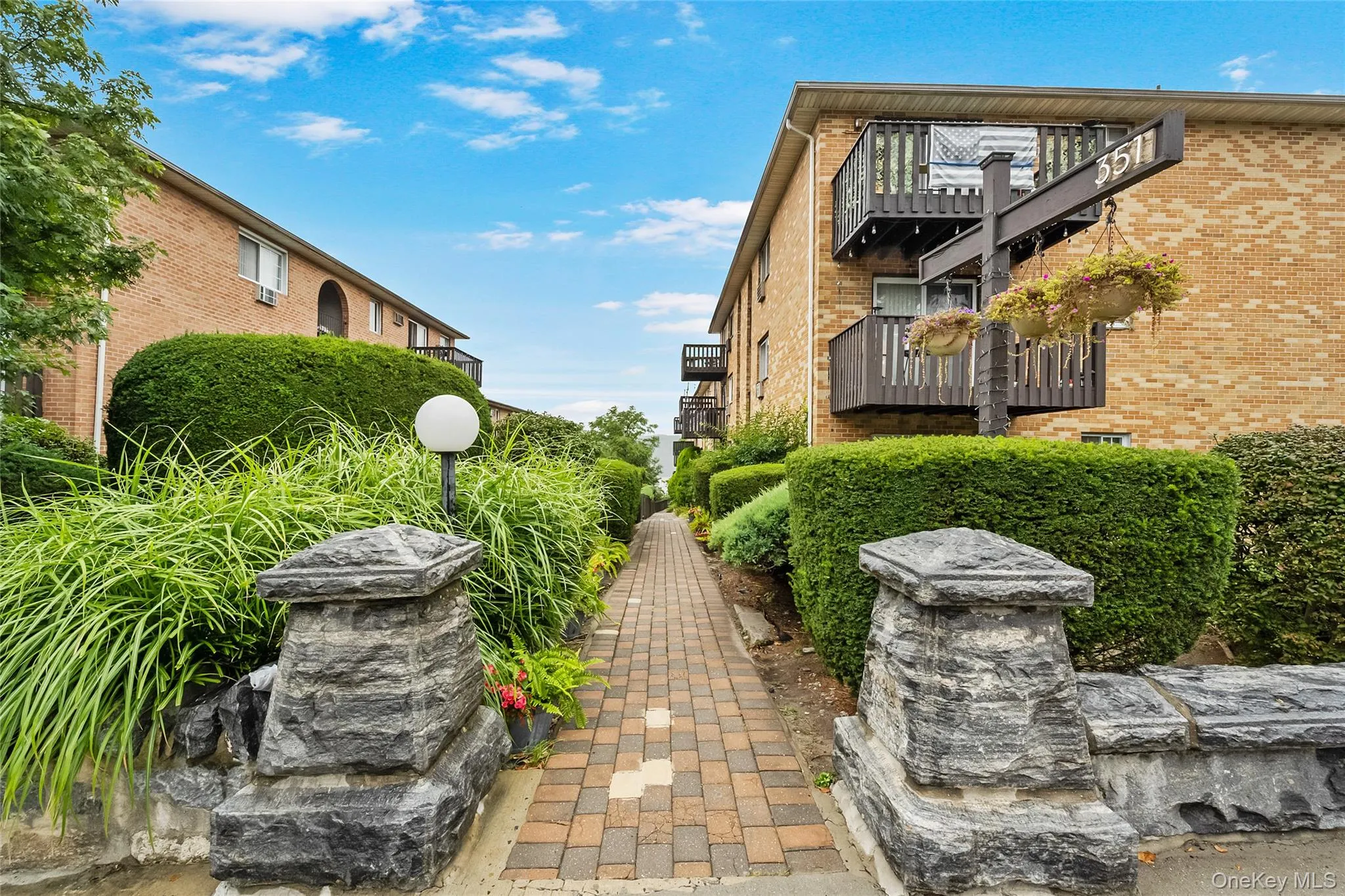 View of property's community featuring a balcony View of property's community featuring a balcony